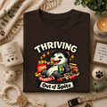 Thriving Possum T-Shirt — "Thriving Out of Spite" Funny Snack-Loving Design