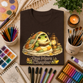 T-Shirt — Cozy Frog “One More Chapter” Graphic Tee